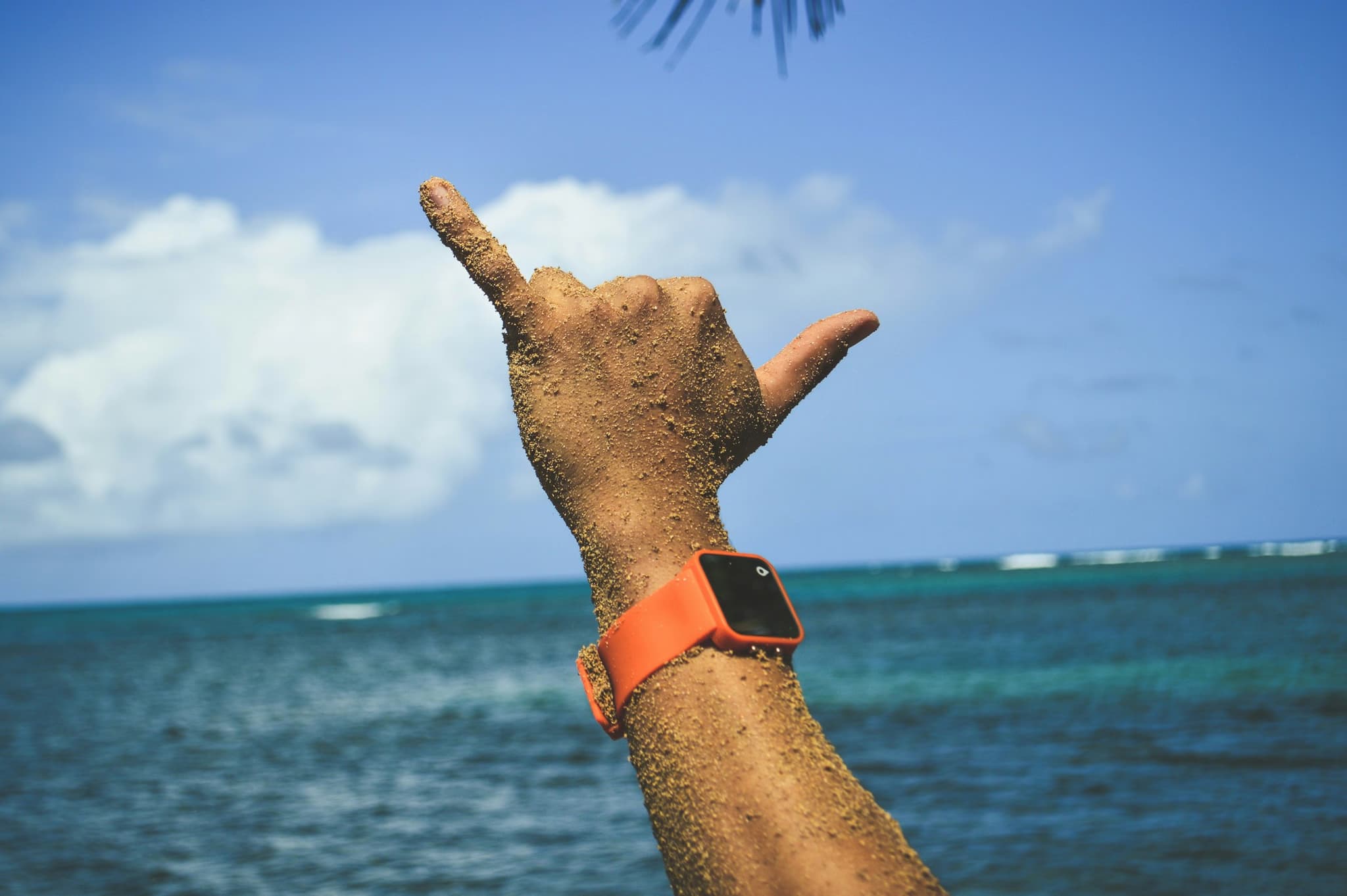 Shaka hand sign on beach