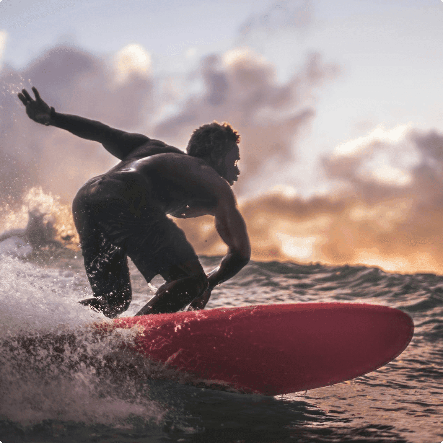 Surfer riding on board front