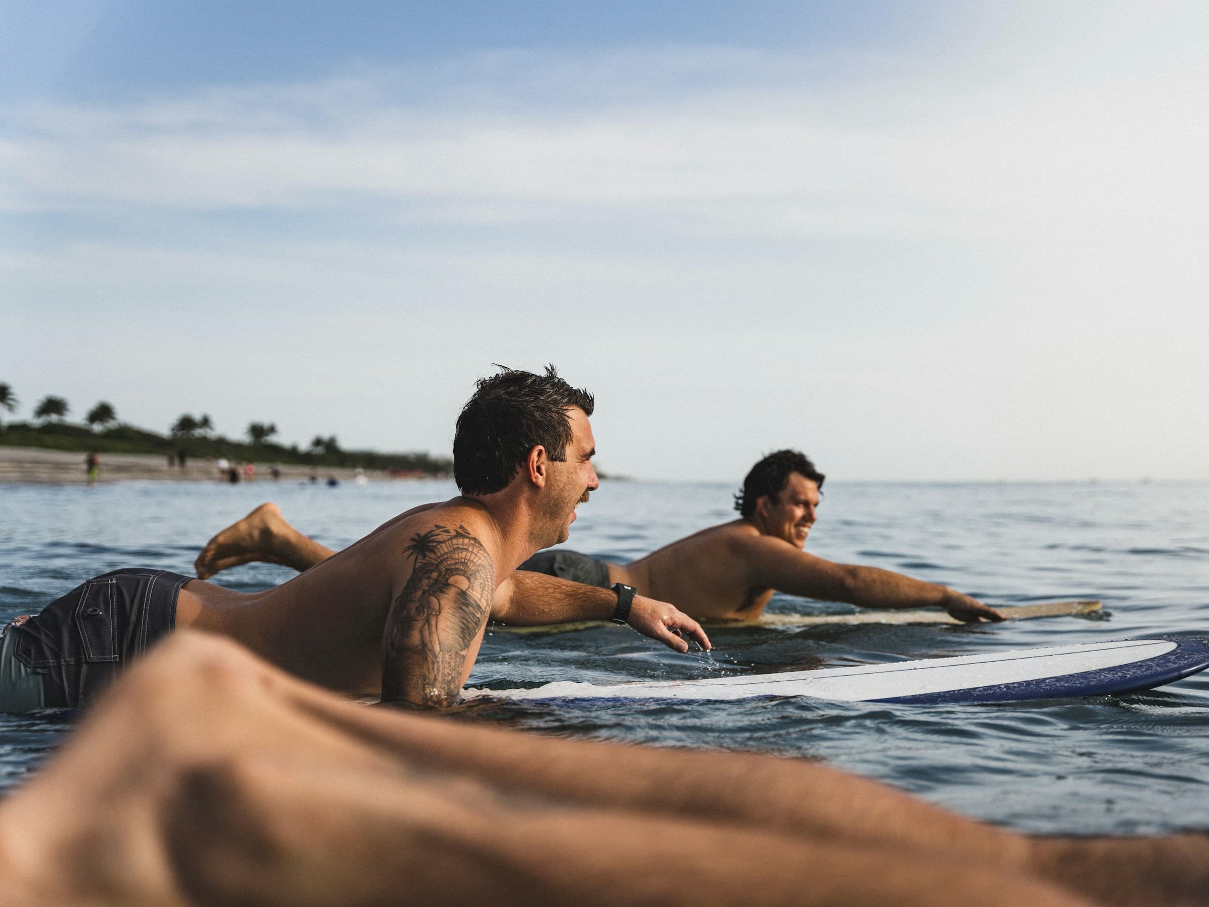 Surfer getting air above wave