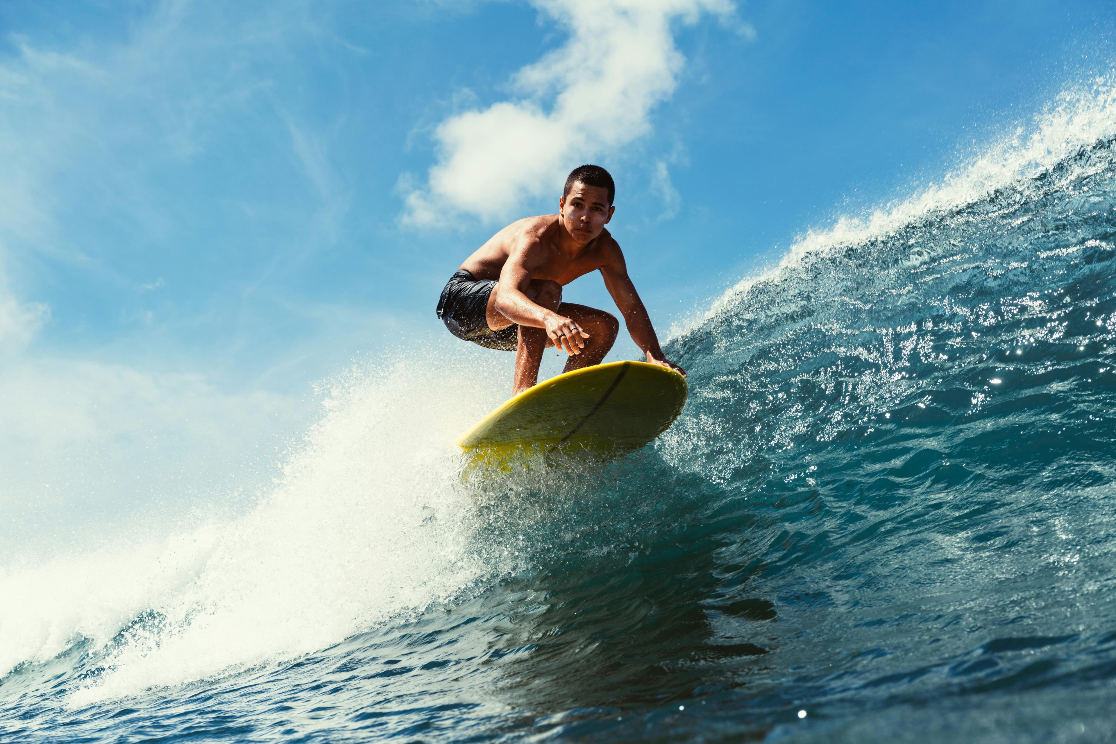 Surfer profile walking into sea